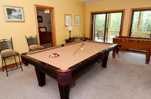 game room includes pool table and foosball
