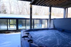 soak in the outdoor hot tub on lower level near pool